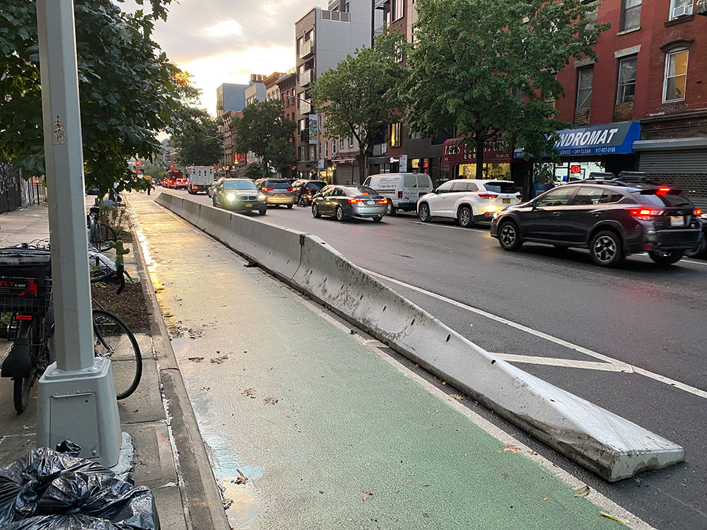 concrete barriers protecting the grand street bike lane in East Williamsburg