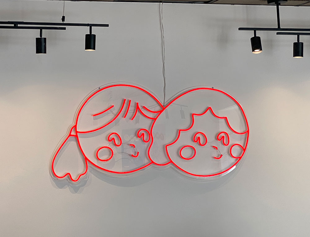 The Store logo on the interior wall of Sweetie's K Chicken in Greenpoint 