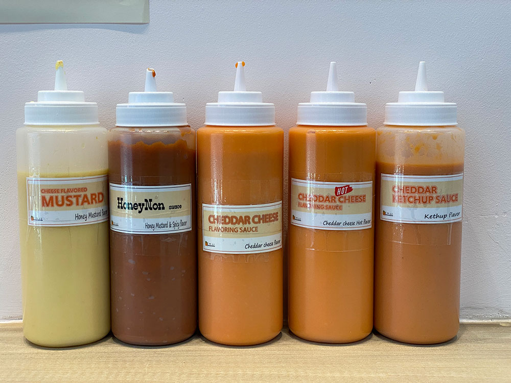 Sauce time -- Sweetie's K Chicken in Greenpoint offers a variety of sauces to top the korean hot dogs