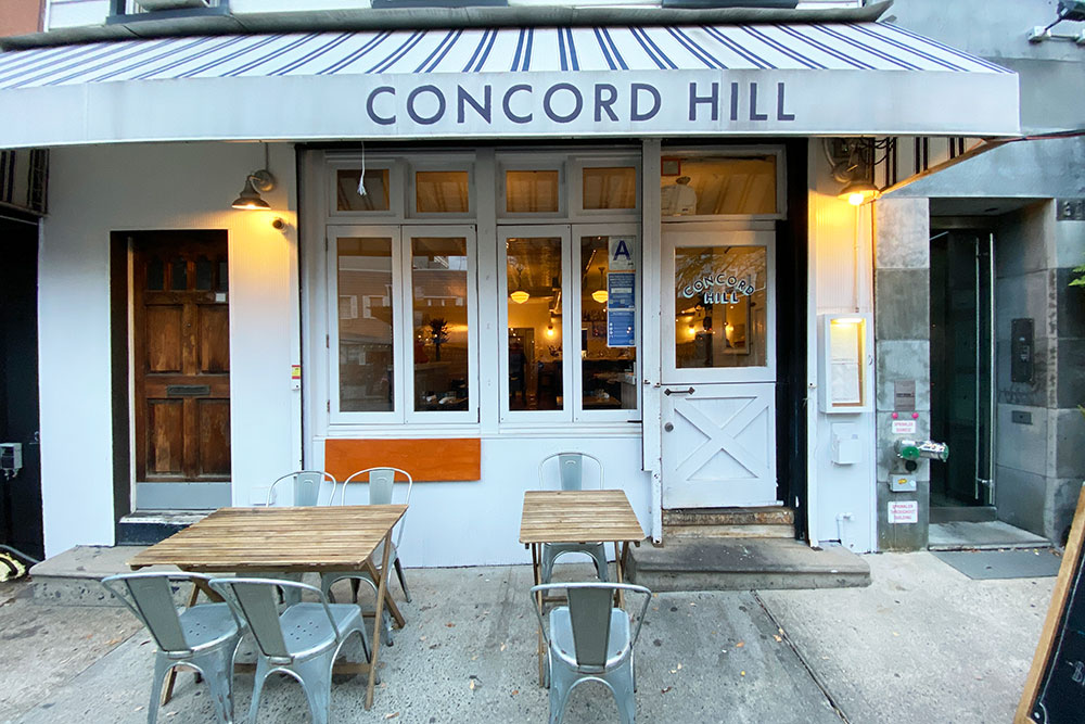 Concord Hill in it's hey day with sidewalk tables