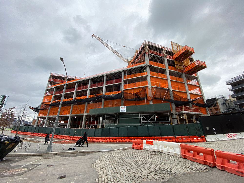 Domino redevelopment towers on the Williamsburg waterfront faces the williamsburg bridge